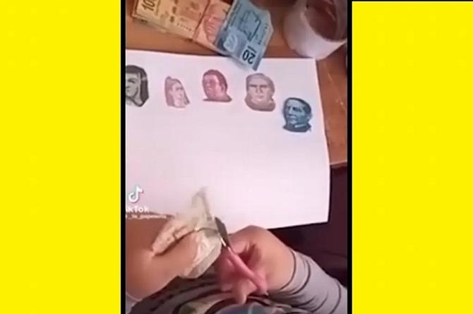 ¡Qué traviesa! Recorta billetes para hacer la tarea de los Héroes Mexicanos (+video)