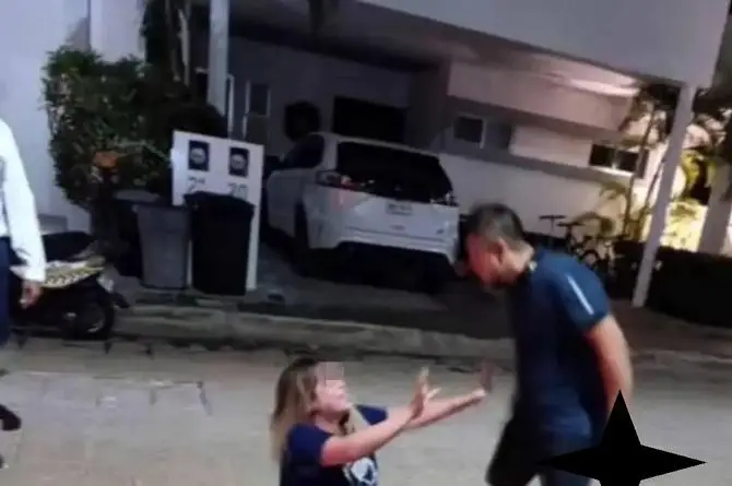 Exhiben a juez que amenaza con arma a su pareja (+fotos)